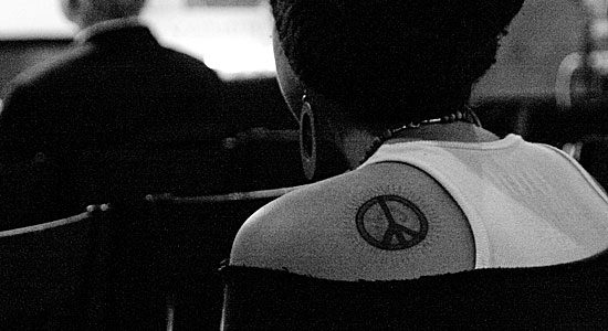 peace tattoo. Student with peace tattoo on